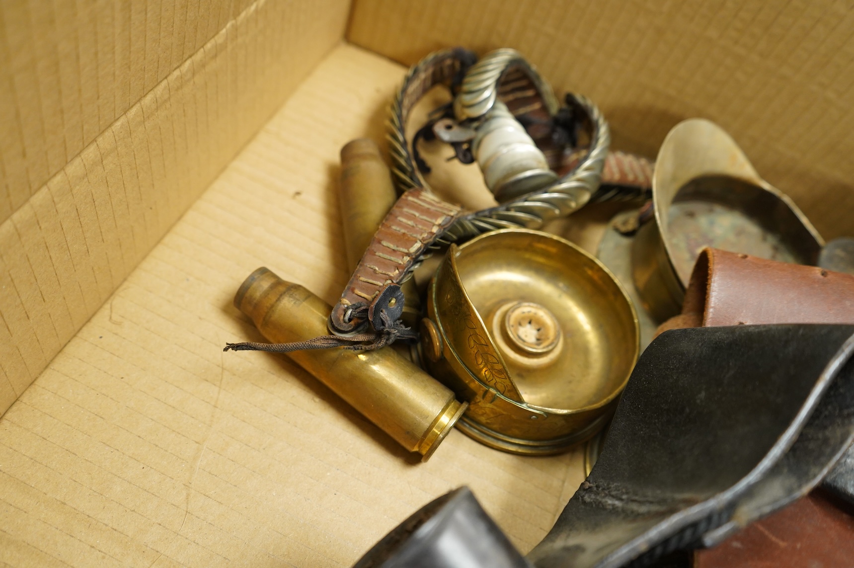 A collection of militaria, etc. including; a Gordon Highlander’s kilt and sporran, three early 20th century Union Flags, a Victorian beaded ‘sweetheart’s’ cushion, two empty First World War Princess Mary Christmas tins,